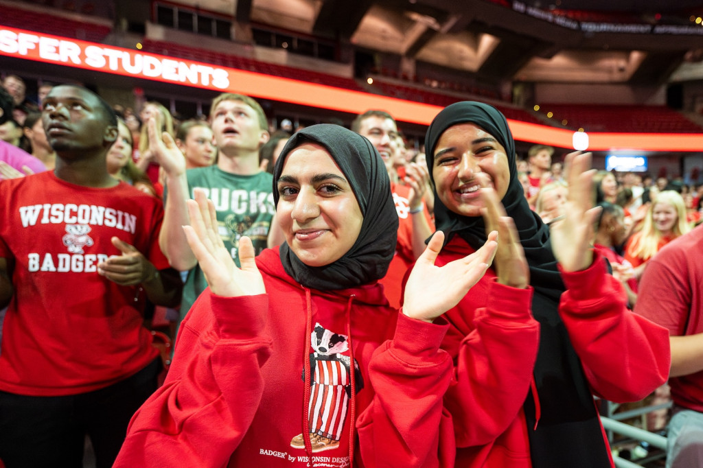 Students in teh stands smile and clap.