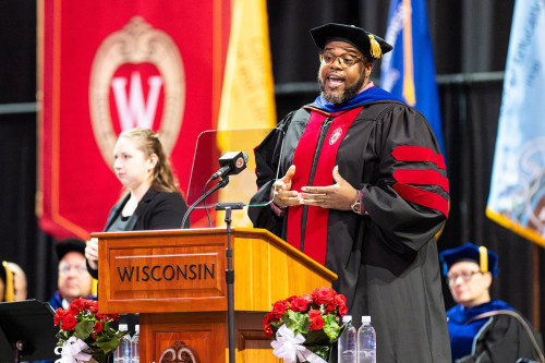 A man speaks at a podium.