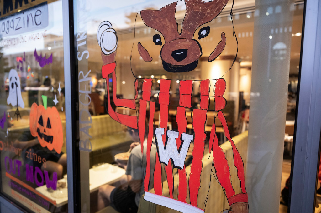 A picture of Bucky Badger is painted on a reflective window.