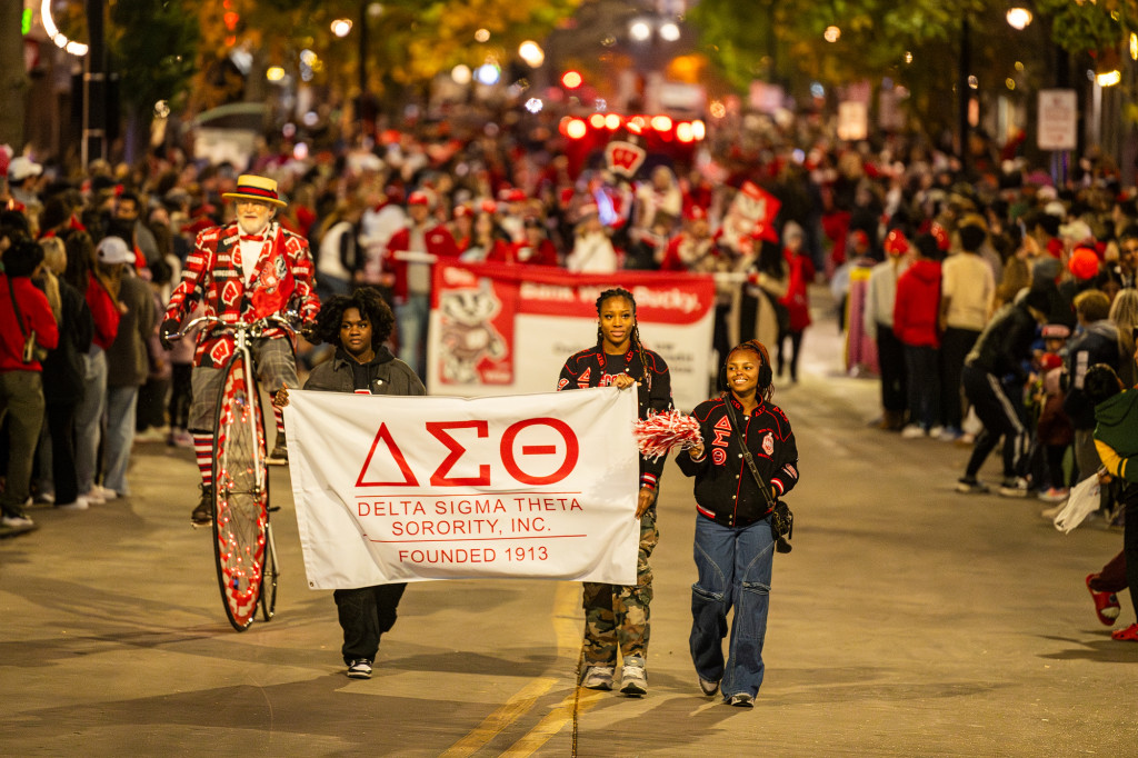 Members of the Delta Sigma Theta Sorority travel down State Street in the parade.