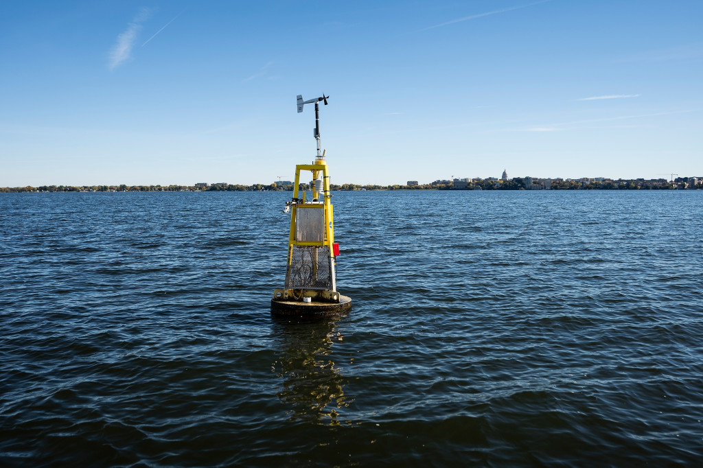 A bouy floats on lake water.