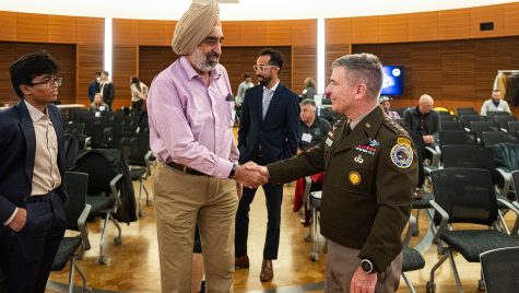 Lt. Gen. Joe Hartman, deputy commander of U.S. Cyber Command, meets with members of the UW community, including Gurindar Sohi (center left), a UW professor of electrical and computer engineering and computer sciences.