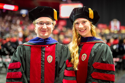 A man and woman in graduation gowns are shown side-by-side.