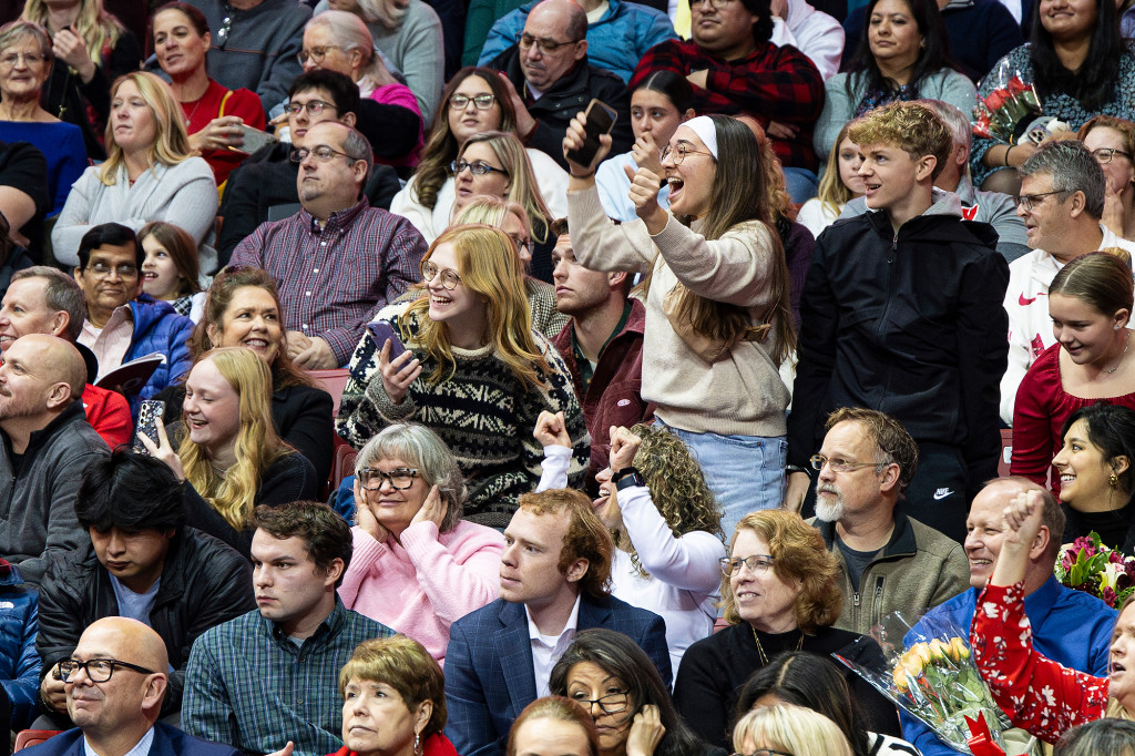 A group of people in the audience cheer.