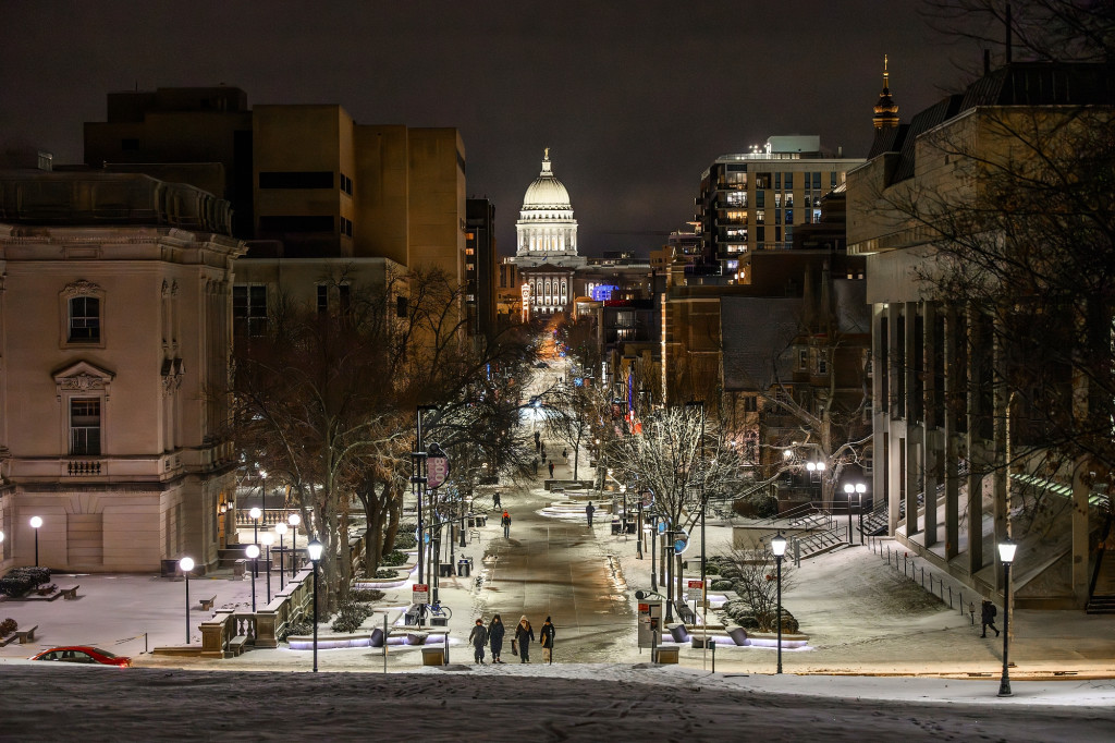 A nighttime shot showing State Street and the state Capitol.