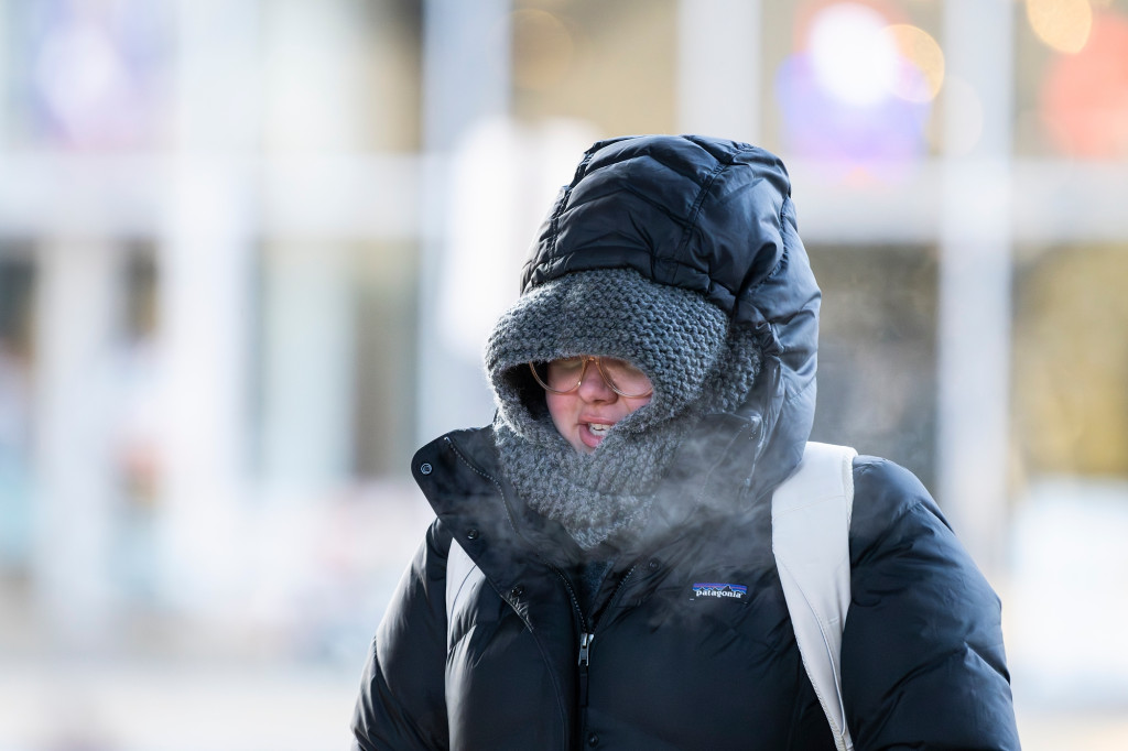 One person is shown bundled up in winter coats.