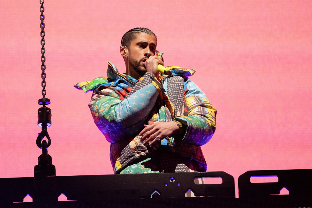 Bad Bunny, wearing a colorful jacket, performs at the Coachella Music & Arts Festival.